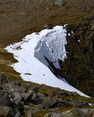 last of the snow on Bowfell - surprised at how near the edge footsteps go