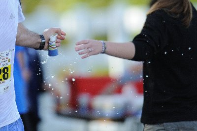 A runner grabbing a cup