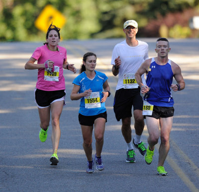 The top two female finishers (Melissa Guckian, pink, 1:23:50; Liza Grudzinski, blue, 1:26:04) ran together on Robinson Lane