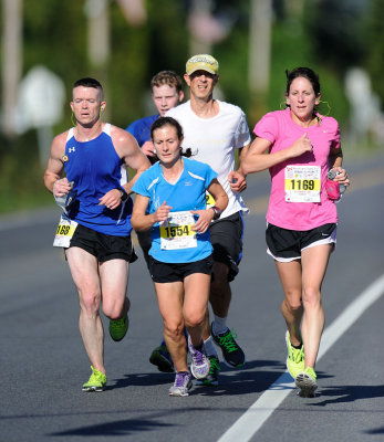 The female co-leaders continued running together on Hillside Lake Road