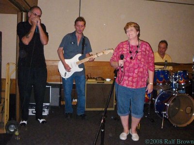 Marcy Brown and Too Tall Billy (on drums) of Sweaty Betty Blues Band