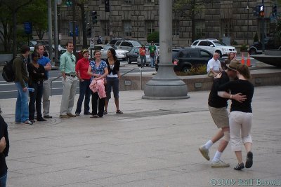 Random passers-by watching the crazy people dance