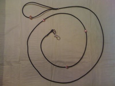 Black bolo braid with 3 rose colored rhinestone beads