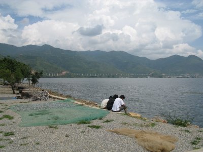 Drying fish and an elevated railway in the background