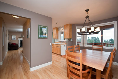 Dining and partial views of the kitchen and family room