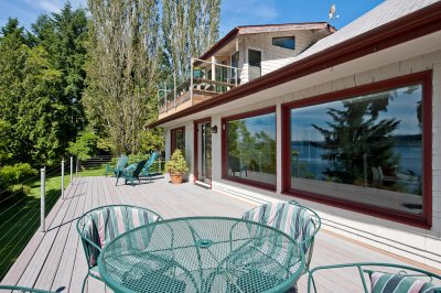 Deck and Colvos Pass reflection in the window