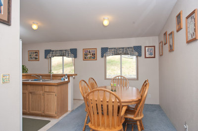 Dining area with kitchen on the left