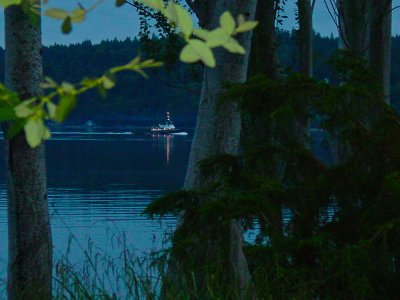 Tugboat passing at dusk in Colvos Pass
