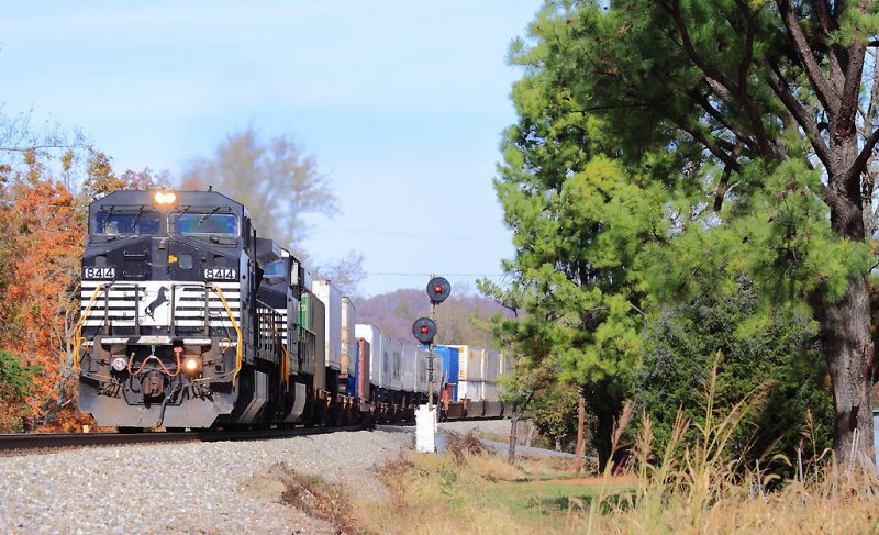 A former CR Dash-8 leads NS 229 past the old searchlight signals at Milledgeville 