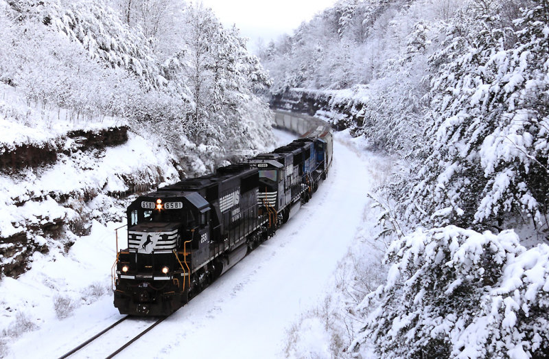 The peace of a frigid Winter morning is shattered by the sound of Three EMDs in #8 with a loaded grain train 