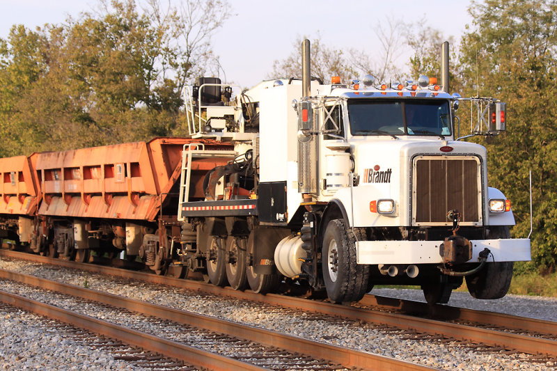 A new kind of work train. A Brant truck with 3 air dump cars, Southbound at north Wye. 