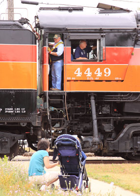 A mother and child watch the 4449 pass