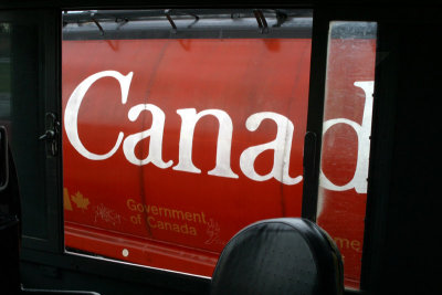 A CN covered hopper framed in the window of 206