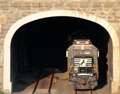 A pair of Eastbound helpers disappear into the tunnel