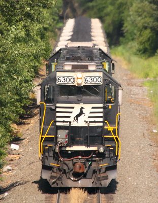 NS 6300 on the rear of a Eastbound coal drag, starting down The Slide