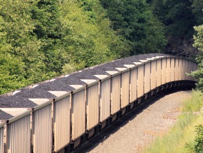A Eastbound coal train starts down the steep grade into the tunnel at Gallitzin