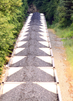 A Eastbound coal train starts down the steep grade into the tunnel at Gallitzin