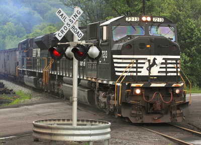 A Pair of Macs on a loaded coal train heads for the mainline