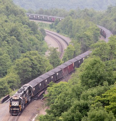 A Eastbound loaded coal drag starts down the slide at Tunnel Hill