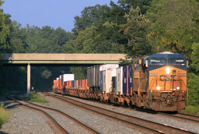 A CSX Westbound rolls into the setting sun 