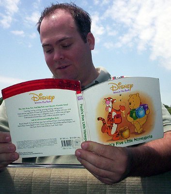 Gregg reads from the book of Pooh