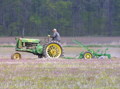 John Deere with plow