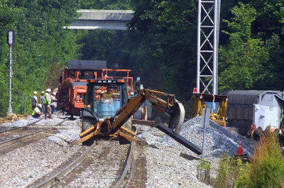 Backhoe man Bobby Hamm clears the siding at East Waddy Ky just before the trains started running again