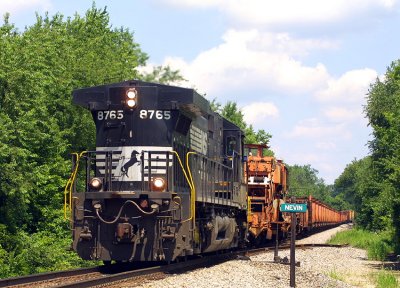 NS 8765 leads rail train 914 East after laying new rail near Waddy. Seen here at Nevin Ky