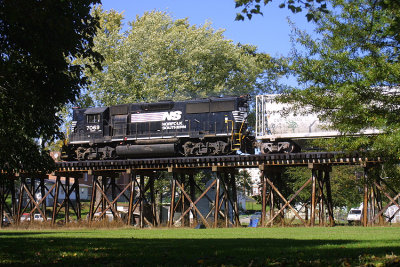 NS 7069 has local T19 well in hand as they cross the bridge in downtown Shlebyville Ky