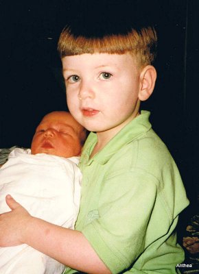 Sarah with her adoring eldest brother, the day she was born, January 2000