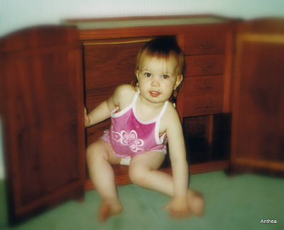 Hiding in the doll cabinet