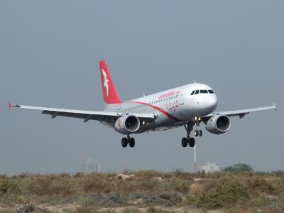 0921 2nd January 09 Air Arabia A320 landing at Sharjah Airport.jpg