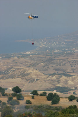 One of the helicopters with Polis in the background