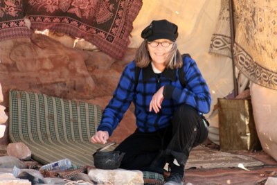 Checking the tea in a Bedouin tent