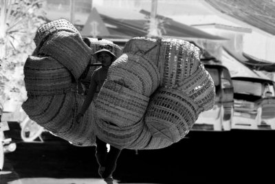 Carrying baskets in Laos