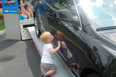 So much so that he was kissing a chevy Malibu that was on display
