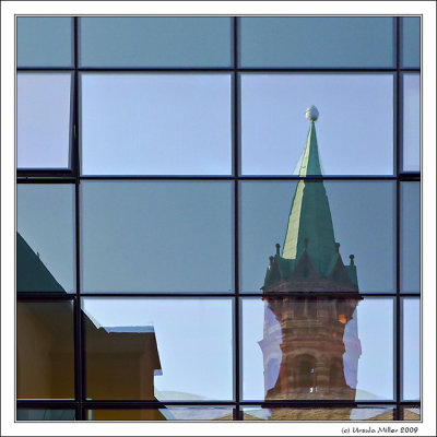 Reflection of a Small Cathedral Tower