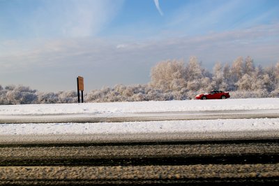 Snowy Meadowbrook Parkway with Red Mustang Convertible