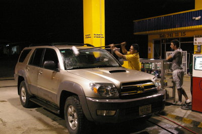 Getting Some Petrol and a Windshield Cleaning at a 24 Horas Station
