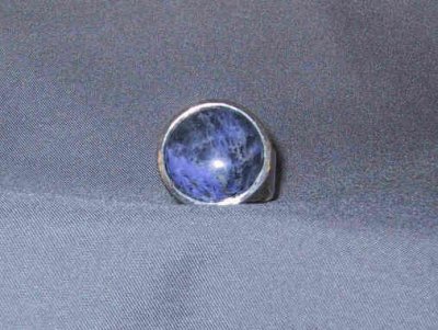 This ring has an 18mm sodalite in a hammered setting.  SOLD