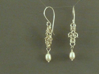 Chain-maille earrings with fresh water pearl dangles.