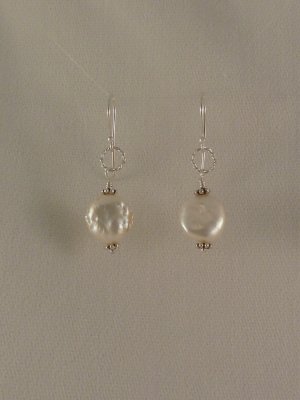Fresh water pearl discs with sterling accents.