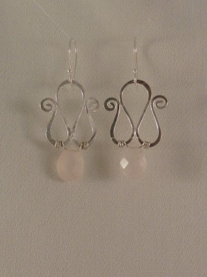Rose quartz teardrops set below scrolled and hammered sterling wire. Sold
