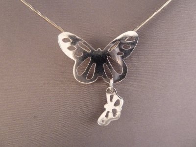 Double butterfly pendant. Hand cut sterling silver, of course.
