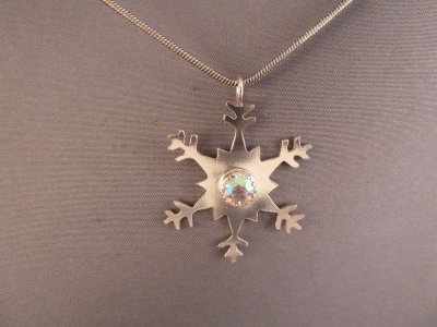 Sterling silver snowflake with vintage rhinestone.