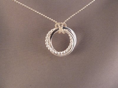 Three intertwined sterling silver circles. SOLD
