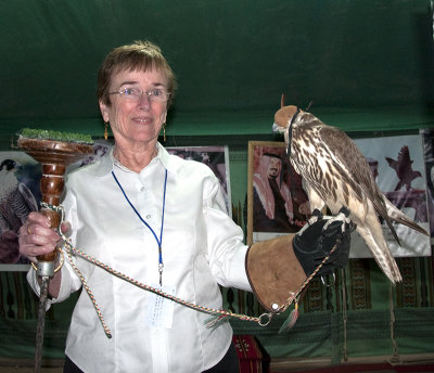 Nancy Crays Holding Falcon at Desert Dinner, Dhahran