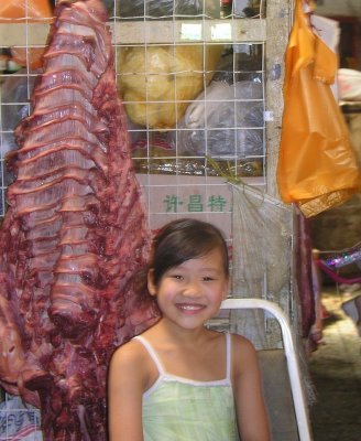 Beijing market - girl with carcas