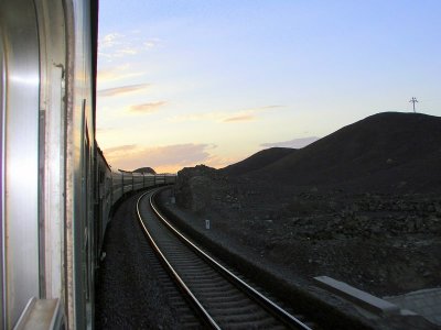 Train climbing grade at sunset