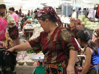 Margilan (Fergana Valley) - market - note traditional ikat pattern dress